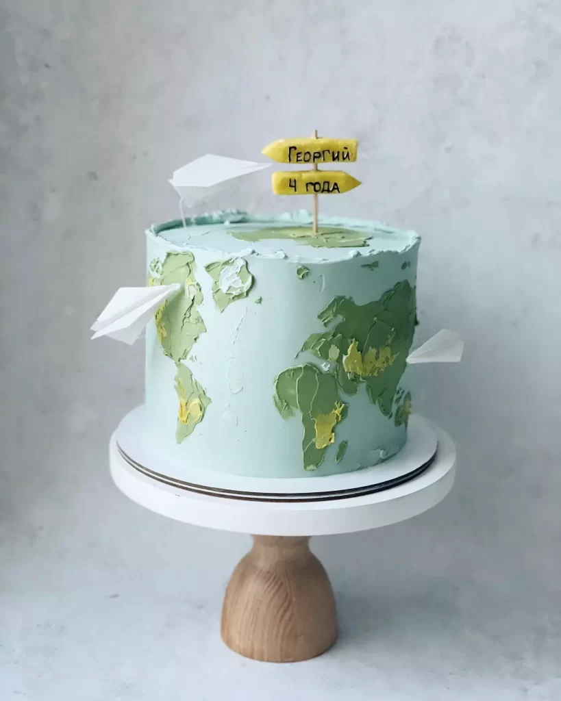 Торт у вигляді карти світу з літачками Торт в виде карты мира с самолетиками